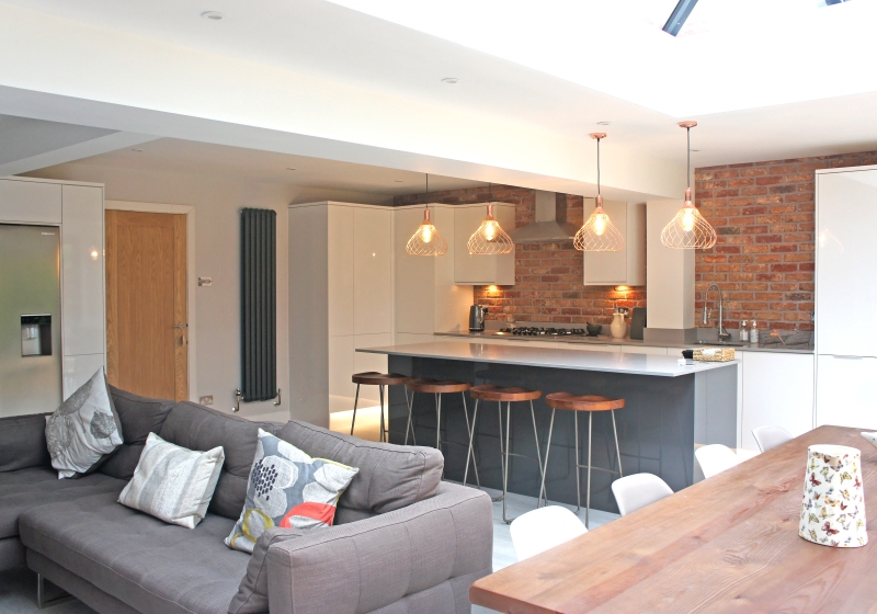 A property extension with a kitchen that has a breakfast bar area