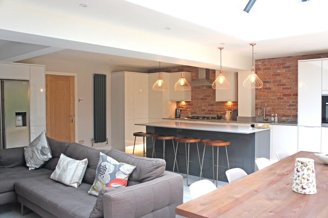 A property extension with a kitchen that has a breakfast bar area