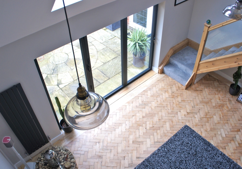 A staircase and parquet flooring in a property extension